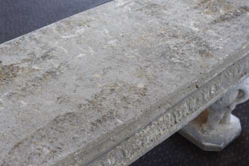 A gorgeous solid concrete outdoor garden bench with beautifully detailed "elephant" leg supports