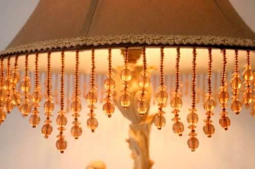 A gorgeous ornate alabastrine oxylite table lamp with stunning detailing and a stylish shade.