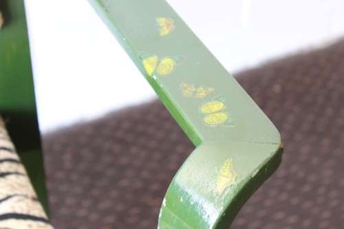 **RS17** A green painted yellow wood armchair with animal print & matching mid-century footrest