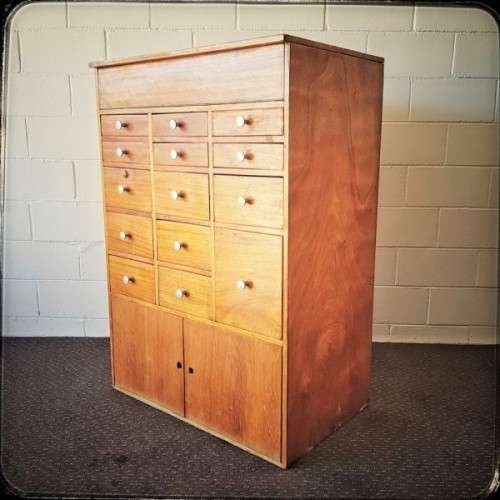An awesome mid-century 14-drawer Apothecary cabinet with a double door cupboard and preparation top