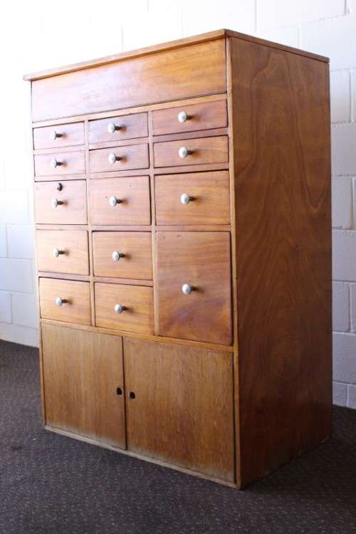 An awesome mid-century 14-drawer Apothecary cabinet with a double door cupboard and preparation top