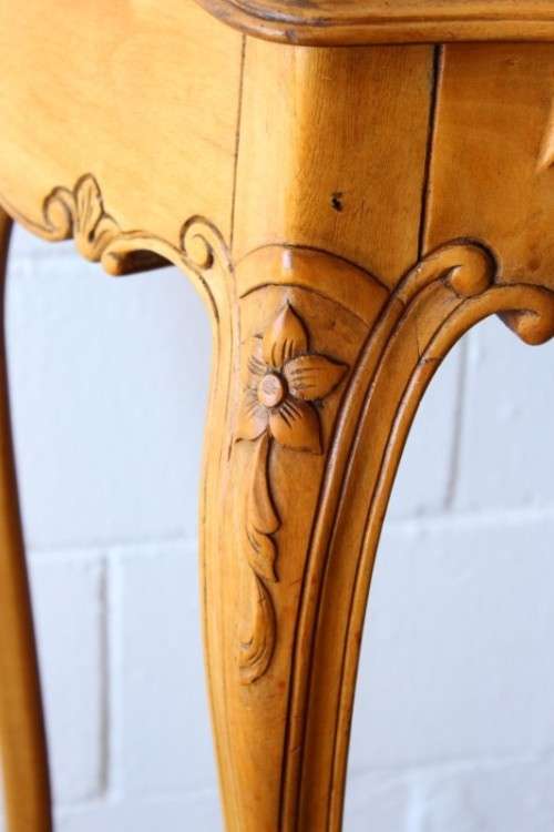 A beautiful ornately carved Yew wood console/ hall table with an ebony stained top on cabriole legs