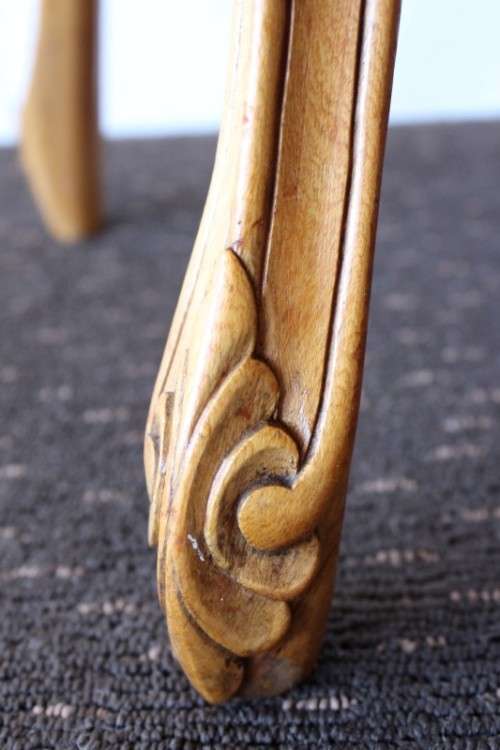 A beautiful ornately carved Yew wood console/ hall table with an ebony stained top on cabriole legs