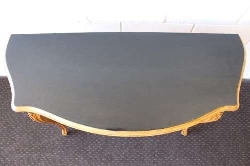 A beautiful ornately carved Yew wood console/ hall table with an ebony stained top on cabriole legs