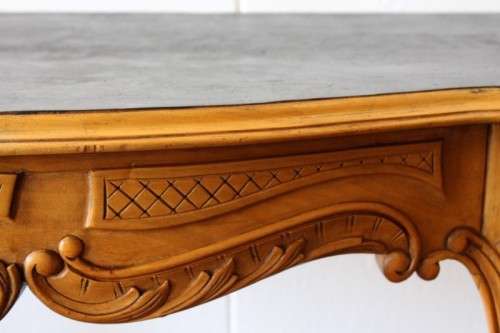 A beautiful ornately carved Yew wood console/ hall table with an ebony stained top on cabriole legs