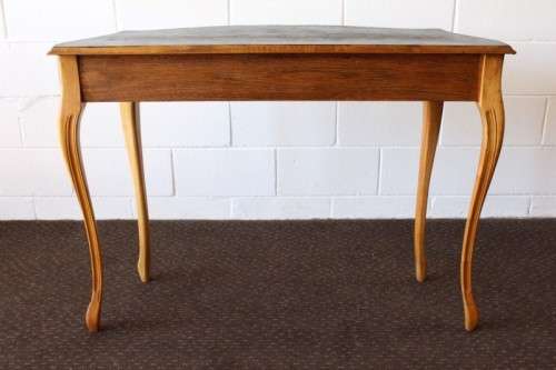 A beautiful ornately carved Yew wood console/ hall table with an ebony stained top on cabriole legs