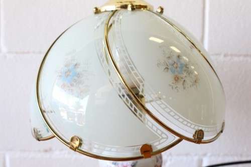 A lovely parlour table lamp with a glass panelled shade and brass-finished base - stunning on a desk