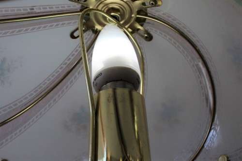A lovely parlour table lamp with a glass panelled shade and brass-finished base - stunning on a desk