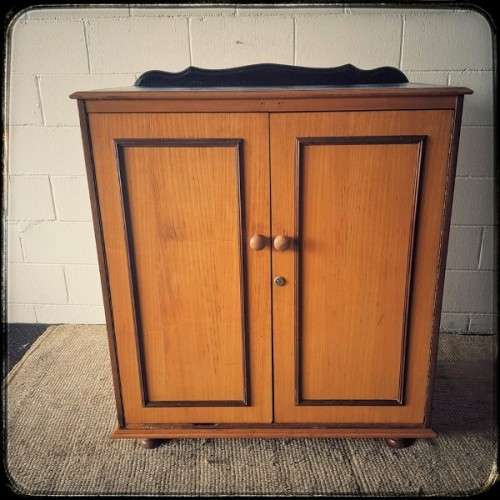 A wonderful Imbuia and Yellow wood double-door cabinet with shelves & space for a bar fridge