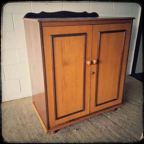 A wonderful Imbuia and Yellow wood double-door cabinet with shelves & space for a bar fridge