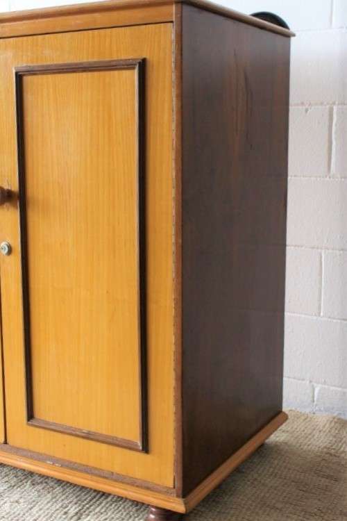 A wonderful Imbuia and Yellow wood double-door cabinet with shelves & space for a bar fridge