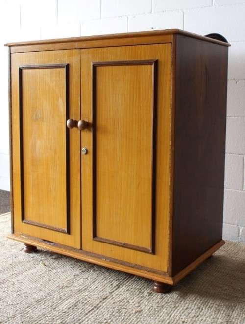 A wonderful Imbuia and Yellow wood double-door cabinet with shelves & space for a bar fridge