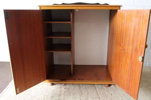 A wonderful Imbuia and Yellow wood double-door cabinet with shelves & space for a bar fridge