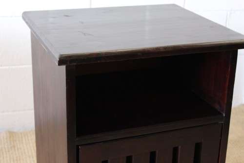 A modern pair of stylish dark wooden bedside pedestals with single doors and uncomplicated design!!