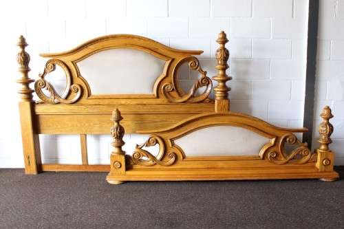 A stunning ornately carved solid Oak headboard and footboard set with upholstered centre panels!