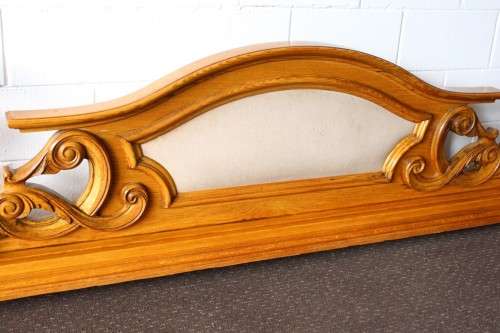 A stunning ornately carved solid Oak headboard and footboard set with upholstered centre panels!