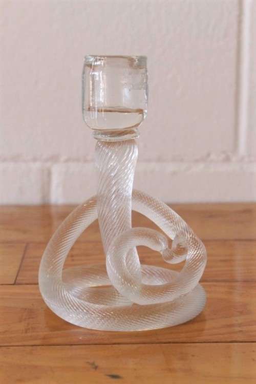 A stunning & very unusual hand blown glass single-candle candle stick w/ an incredible twirled base