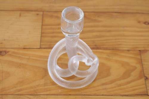 A stunning & very unusual hand blown glass single-candle candle stick w/ an incredible twirled base
