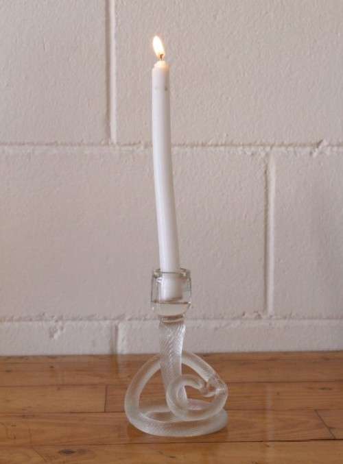 A stunning & very unusual hand blown glass single-candle candle stick w/ an incredible twirled base