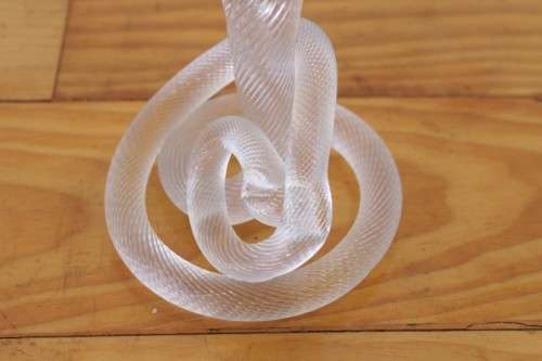 A stunning & very unusual hand blown glass single-candle candle stick w/ an incredible twirled base