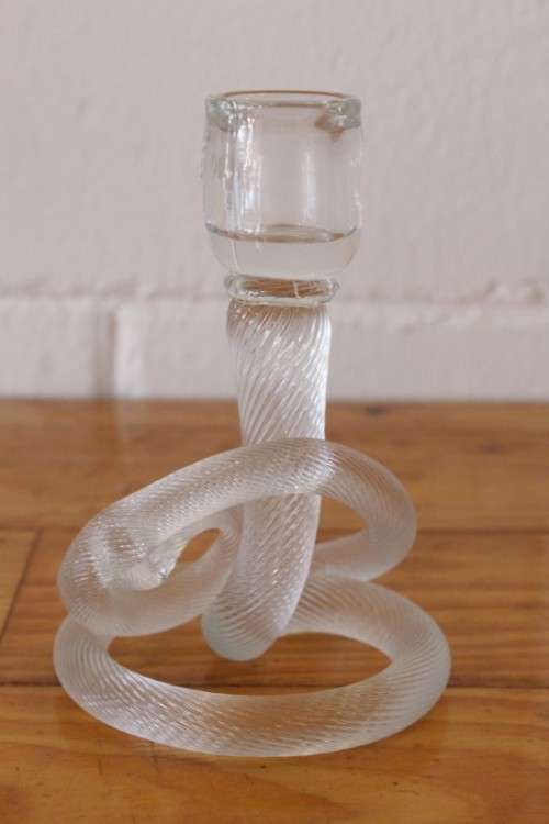 A stunning & very unusual hand blown glass single-candle candle stick w/ an incredible twirled base