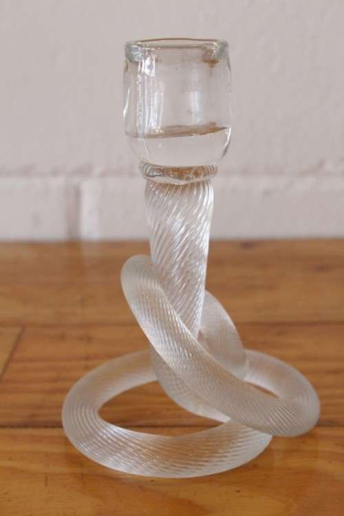A stunning & very unusual hand blown glass single-candle candle stick w/ an incredible twirled base