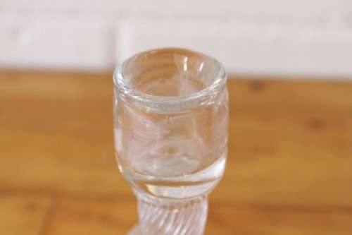 A stunning & very unusual hand blown glass single-candle candle stick w/ an incredible twirled base