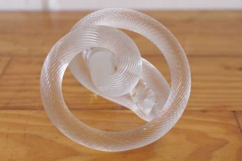 A stunning & very unusual hand blown glass single-candle candle stick w/ an incredible twirled base