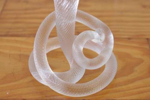 A stunning & very unusual hand blown glass single-candle candle stick w/ an incredible twirled base