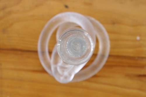A stunning & very unusual hand blown glass single-candle candle stick w/ an incredible twirled base