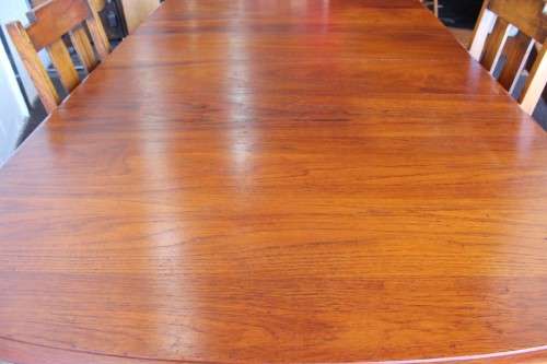 An amazing vintage solid Teak extendable dining room table with four upholstered chairs - stunning!!