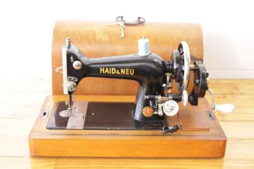 A rare antique German made Haid & Neu hand-cranked sewing machine in its original bentwood box