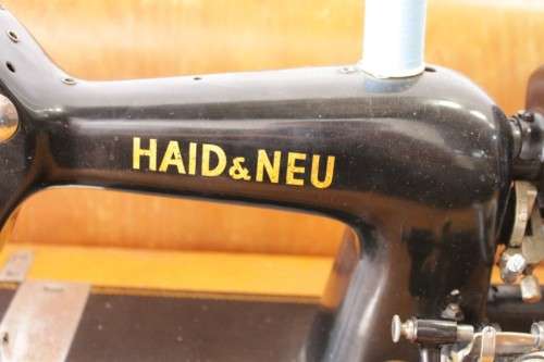 A rare antique German made Haid & Neu hand-cranked sewing machine in its original bentwood box