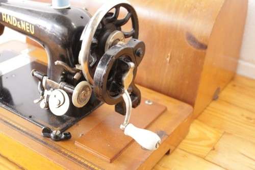 A rare antique German made Haid & Neu hand-cranked sewing machine in its original bentwood box
