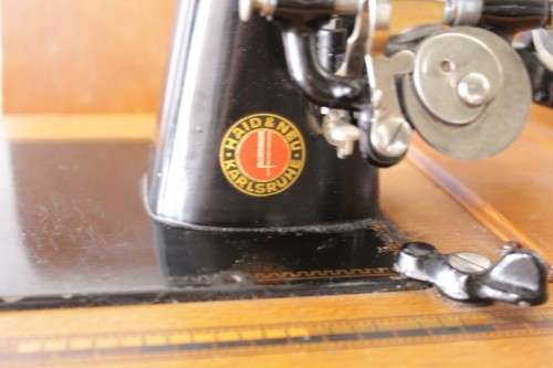 A rare antique German made Haid & Neu hand-cranked sewing machine in its original bentwood box