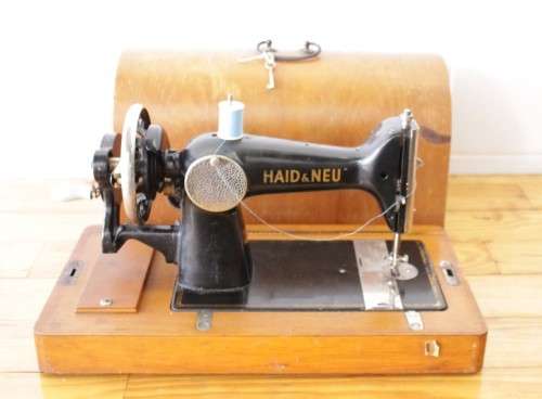 A rare antique German made Haid & Neu hand-cranked sewing machine in its original bentwood box