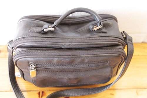**RS17** An original black leather "Hush Puppies" travel document shoulder bag with loads of pockets