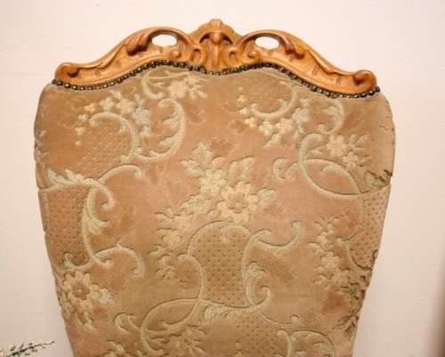 **RS17** A gorgeous Victorian "parlour chair" with carved detailing and floral upholstery.