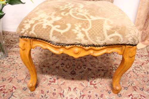 **RS17** A gorgeous Victorian "parlour chair" with carved detailing and floral upholstery.