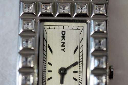 A stunning "DKNY" (ny3651) ladies wrist watch w/ a stainless steel & clear crystal bracelet