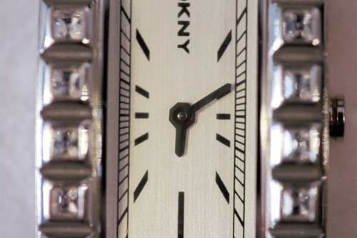 A stunning "DKNY" (ny3651) ladies wrist watch w/ a stainless steel & clear crystal bracelet
