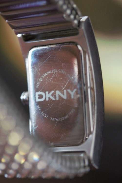 A stunning "DKNY" (ny3651) ladies wrist watch w/ a stainless steel & clear crystal bracelet