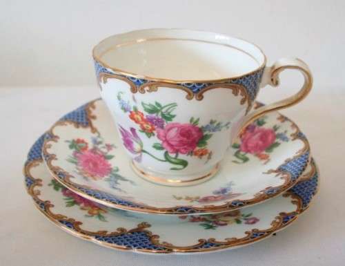 A beautiful vintage "Aynsley" fine bone china "Wilton Blue" pattern trio, gorgeous on display.