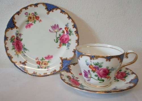 A beautiful vintage "Aynsley" fine bone china "Wilton Blue" pattern trio, gorgeous on display.