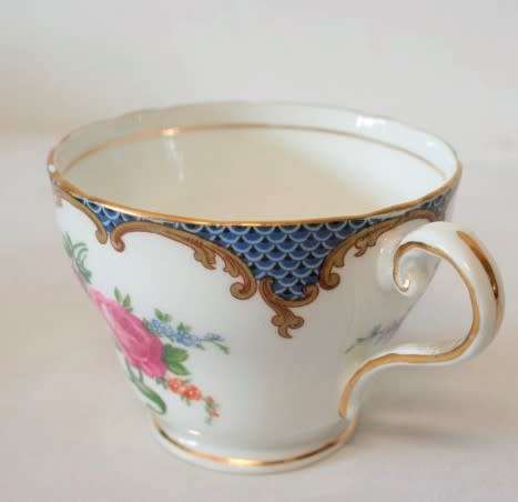 A beautiful vintage "Aynsley" fine bone china "Wilton Blue" pattern trio, gorgeous on display.