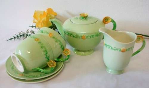 A lovely (1930s) Carlton Ware "Australian design" Yellow buttercup garland design tea set for two