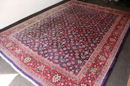 A superb large (4m x 3m) Iranian Tabriz "Afshan" Persian carpet in rich reds, blues and earthy tones