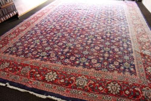 A superb large (4m x 3m) Iranian Tabriz "Afshan" Persian carpet in rich reds, blues and earthy tones