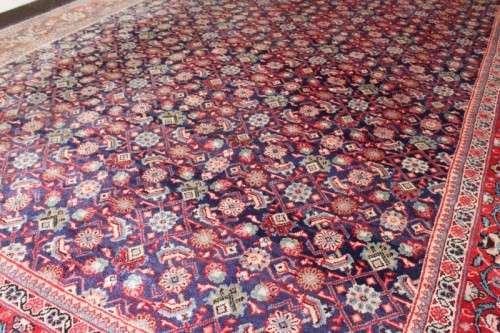 A superb large (4m x 3m) Iranian Tabriz "Afshan" Persian carpet in rich reds, blues and earthy tones