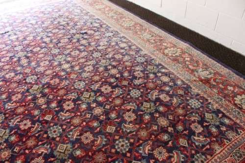 A superb large (4m x 3m) Iranian Tabriz "Afshan" Persian carpet in rich reds, blues and earthy tones